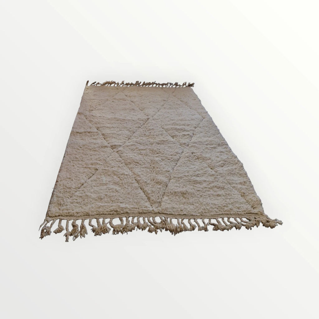 Véritable tapis berbère beni ouarain de l'atlas marocain. Tissé en laine à la main  selon un savoir ancestral.