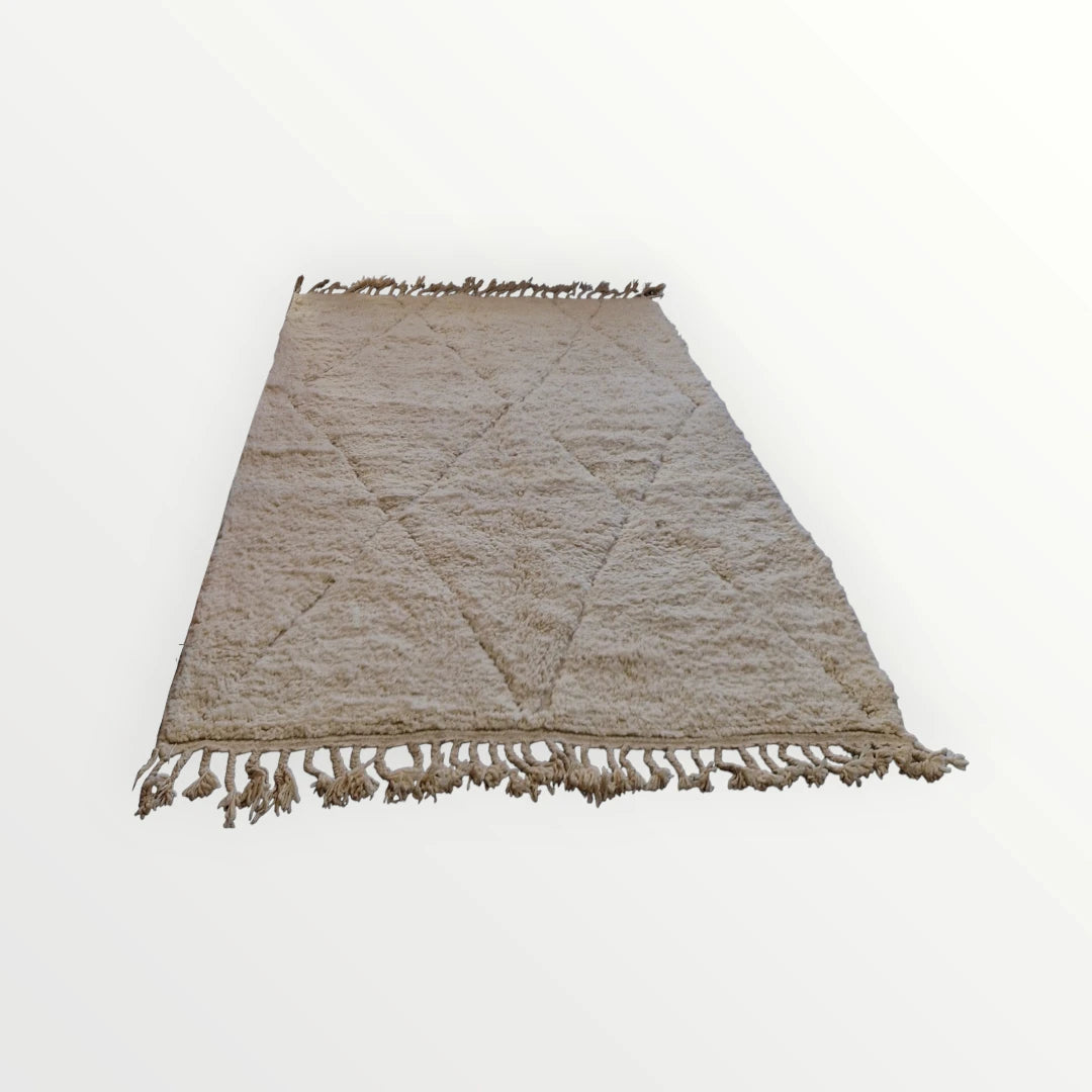 Véritable tapis berbère beni ouarain de l'atlas marocain. Tissé en laine à la main  selon un savoir ancestral.