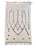 authentique tapis traditionnel marocain, tissé dans l'atlas par des Berbères, fait-mains en pure laine avec des motifs en relief modernes