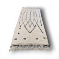 authentique tapis traditionnel marocain, tissé dans l'atlas par des Berbères, fait-mains en pure laine avec des motifs en relief modernes